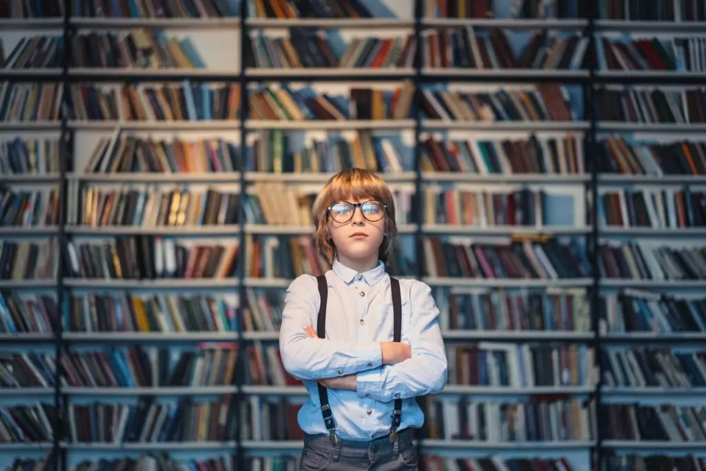 what is the difference between AI and machine learning? Boy in front of a school library 