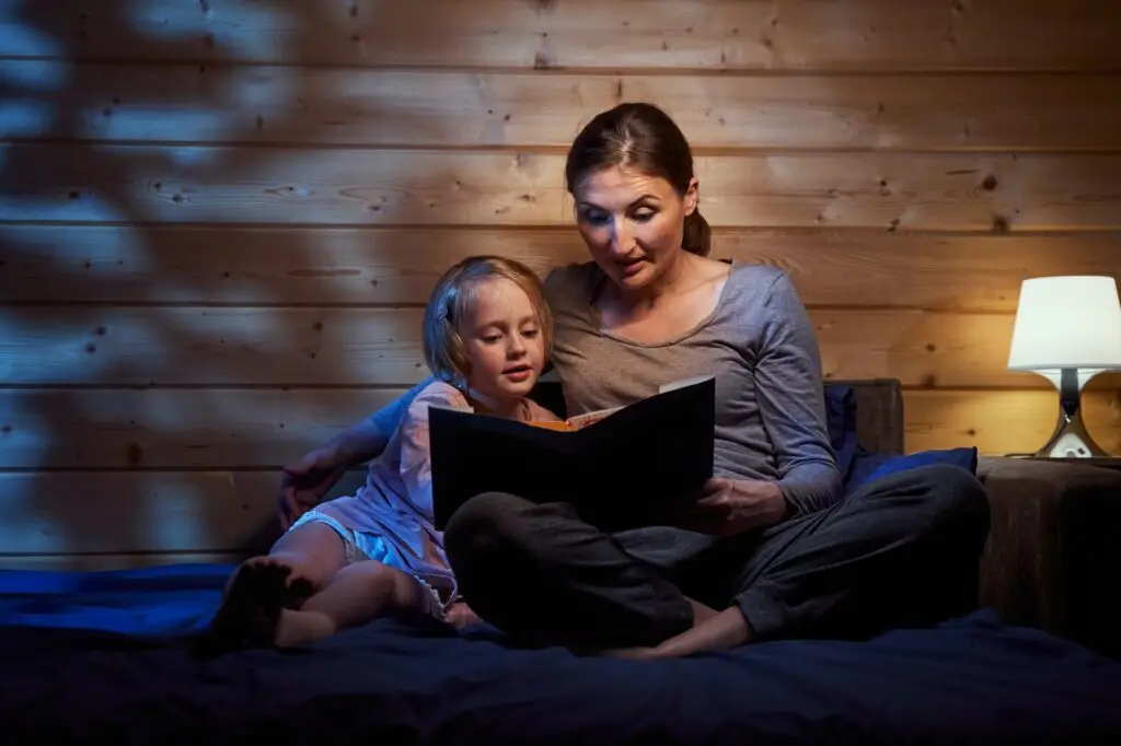 Mother reading bedtime stories to her child