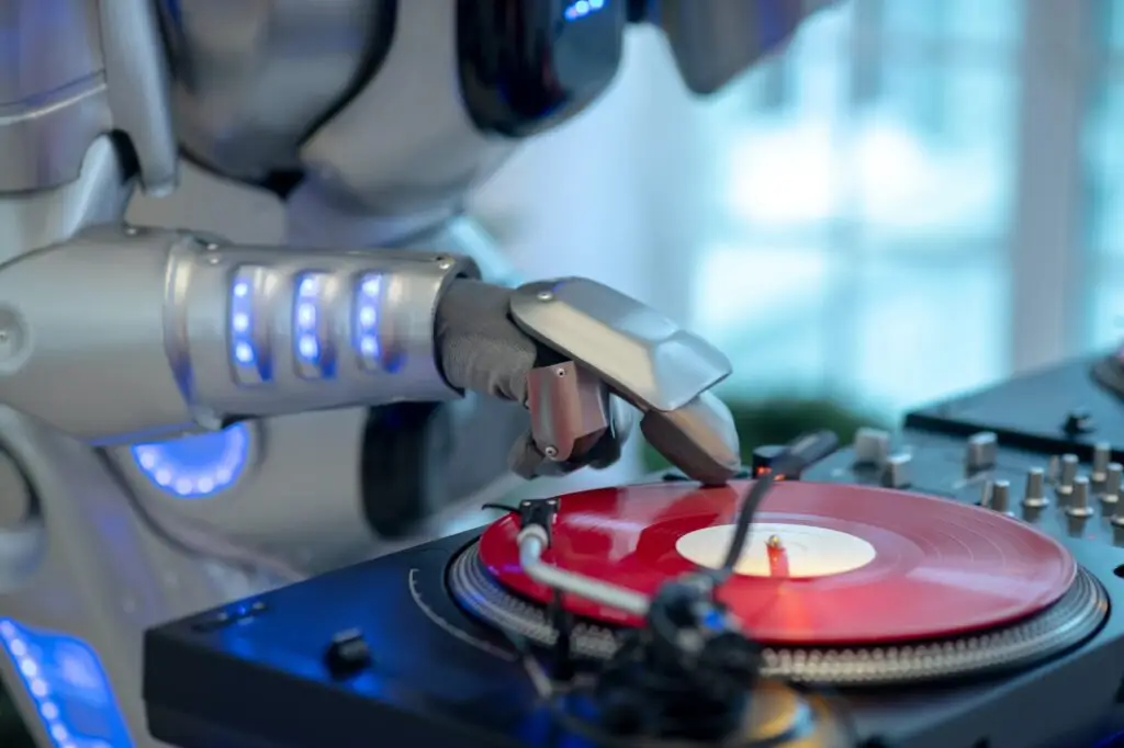 Close up of robots hand touching vinyl