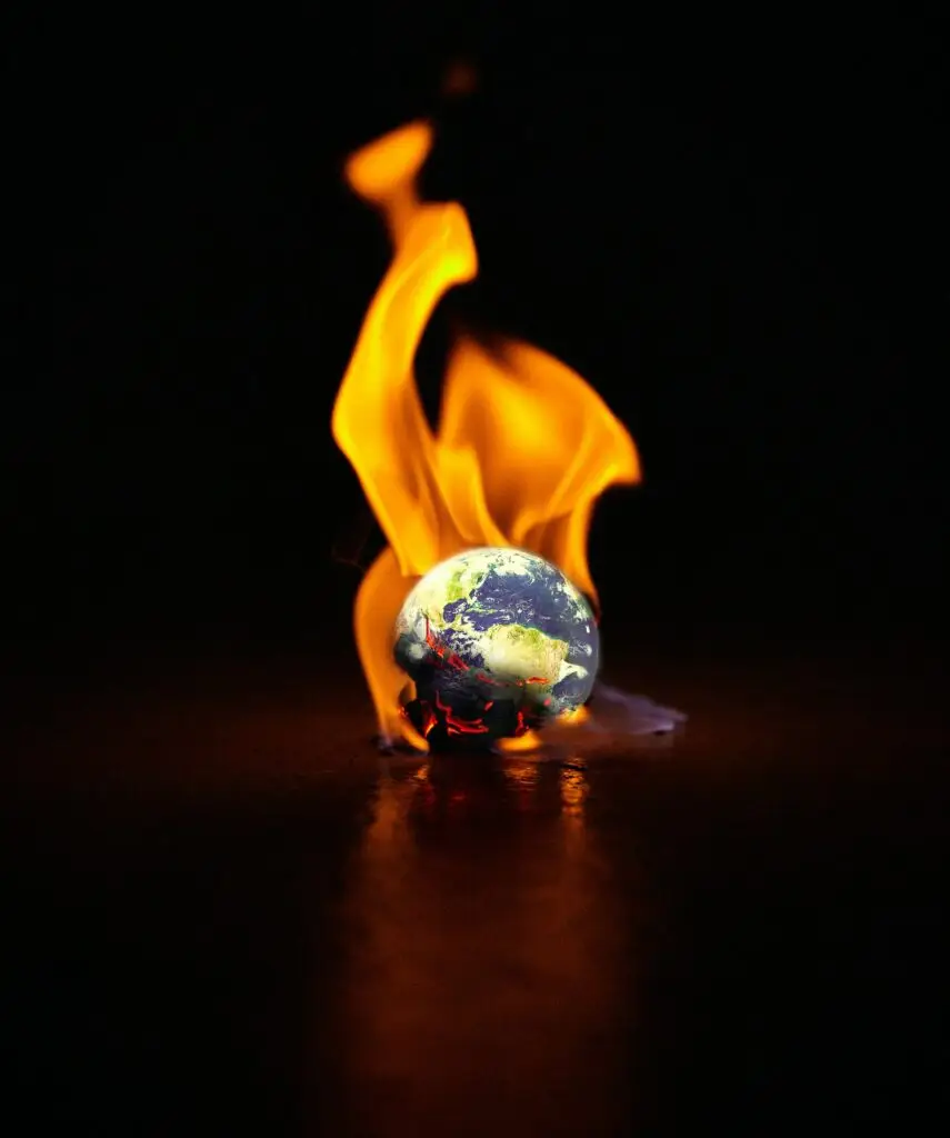 Shot of the earth engulfed in flames against a black background